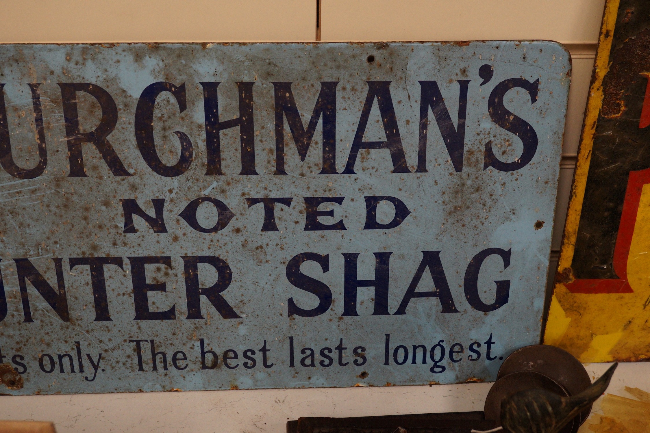 A Churchman's Noted Counter Shag enamel advertising sign, 30x60cm